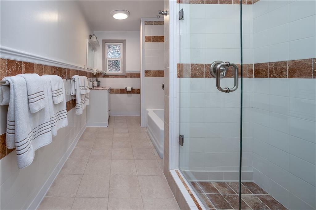 149 Three Degree Road Pittsburgh, PA 15237 - Photo 22 of 50 a bathroom with a shower and mirror