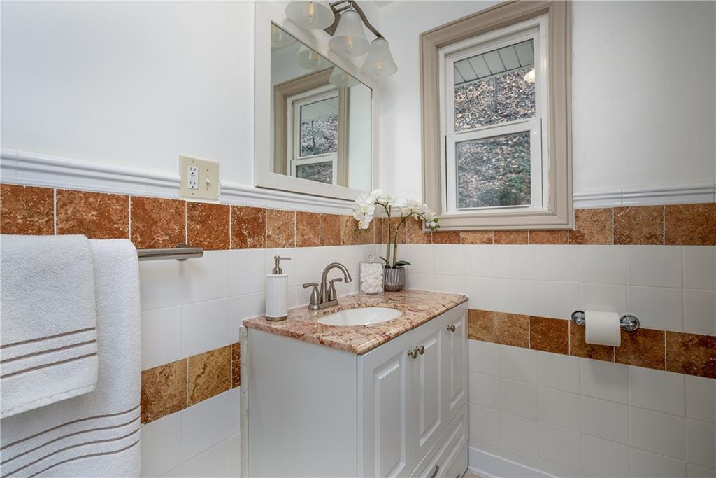 149 Three Degree Road Pittsburgh, PA 15237 - Photo 24 of 50 a bathroom with a sink and a mirror