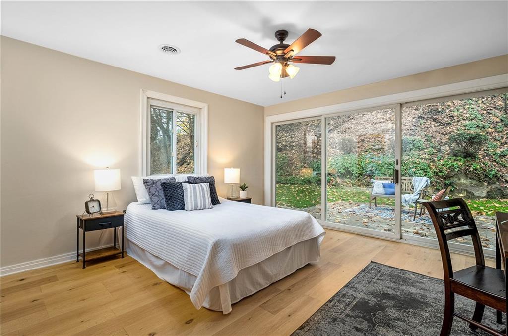149 Three Degree Road Pittsburgh, PA 15237 - Photo 25 of 50 a bedroom with a bed and a large window