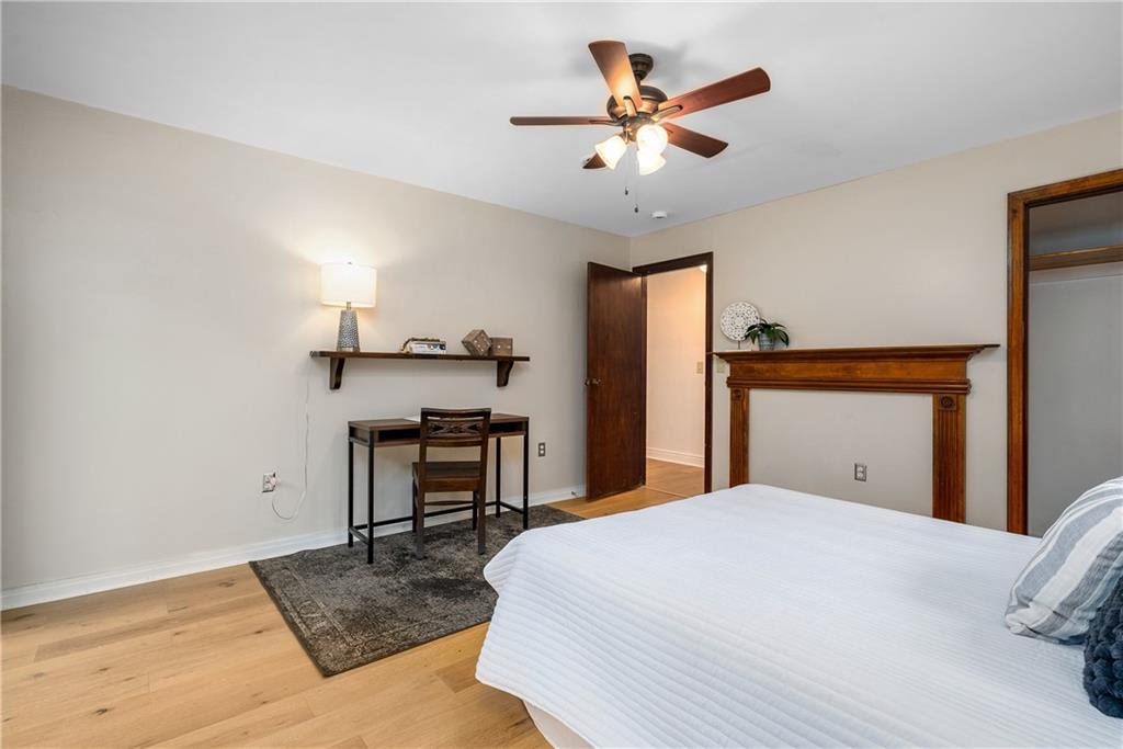 149 Three Degree Road Pittsburgh, PA 15237 - Photo 26 of 50 a bedroom with a bed and a chandelier