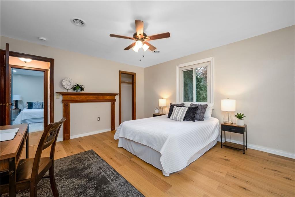 149 Three Degree Road Pittsburgh, PA 15237 - Photo 27 of 50 a bedroom with a bed and a chandelier