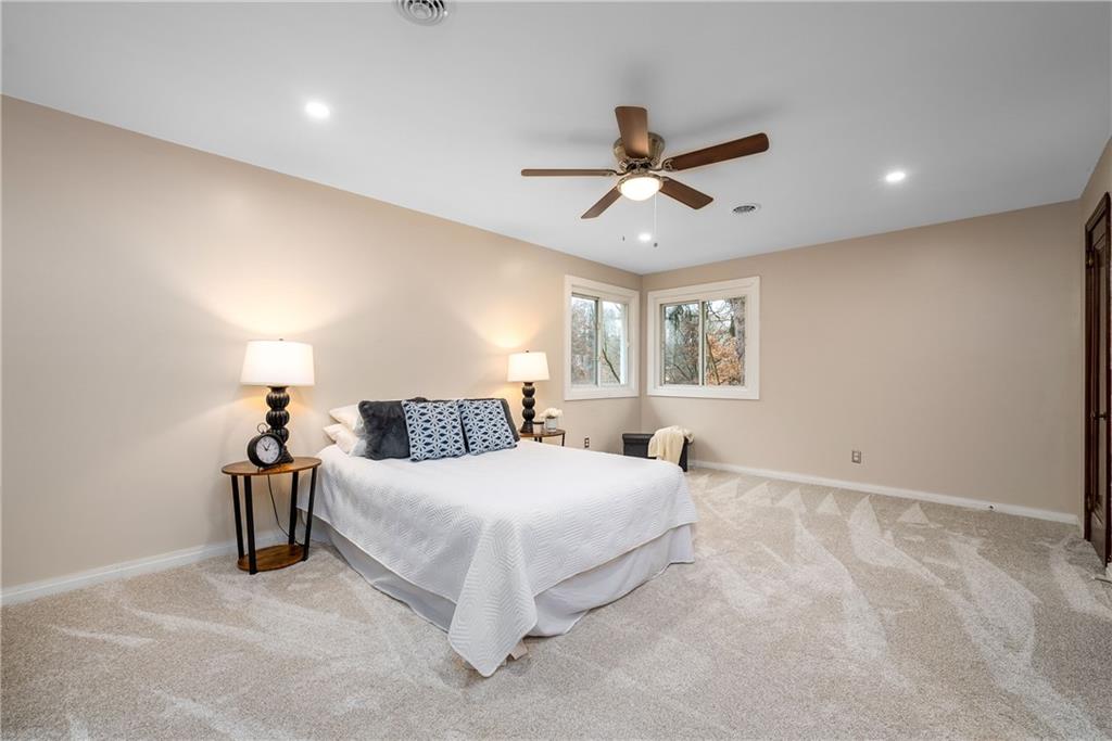 149 Three Degree Road Pittsburgh, PA 15237 - Photo 29 of 50 a bedroom with a bed and a chandelier