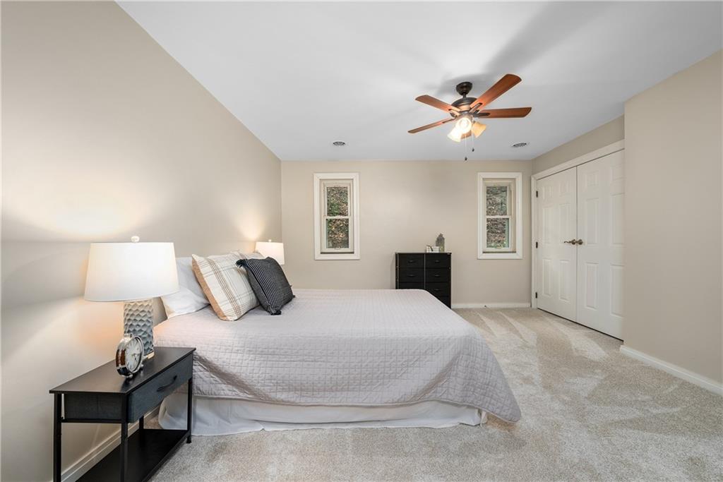 149 Three Degree Road Pittsburgh, PA 15237 - Photo 32 of 50 a bedroom with a bed and a chandelier
