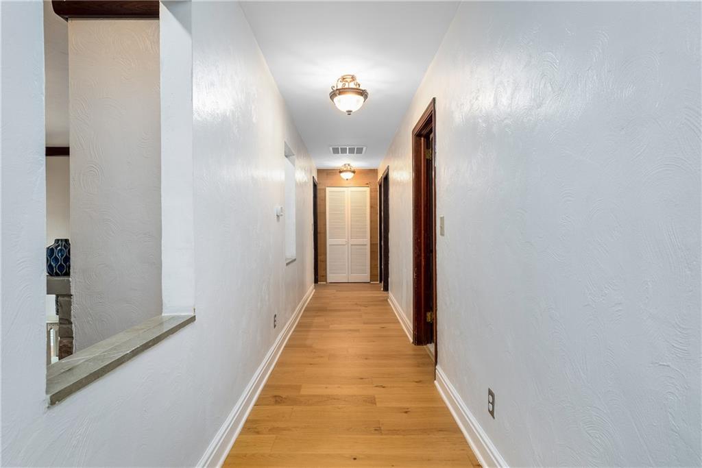 149 Three Degree Road Pittsburgh, PA 15237 - Photo 35 of 50 a view of a hallway with wooden floor and a bathroom