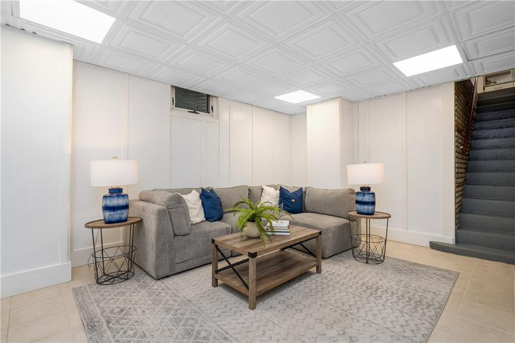 149 Three Degree Road Pittsburgh, PA 15237 - Photo 39 of 50 a living room with furniture and a rug