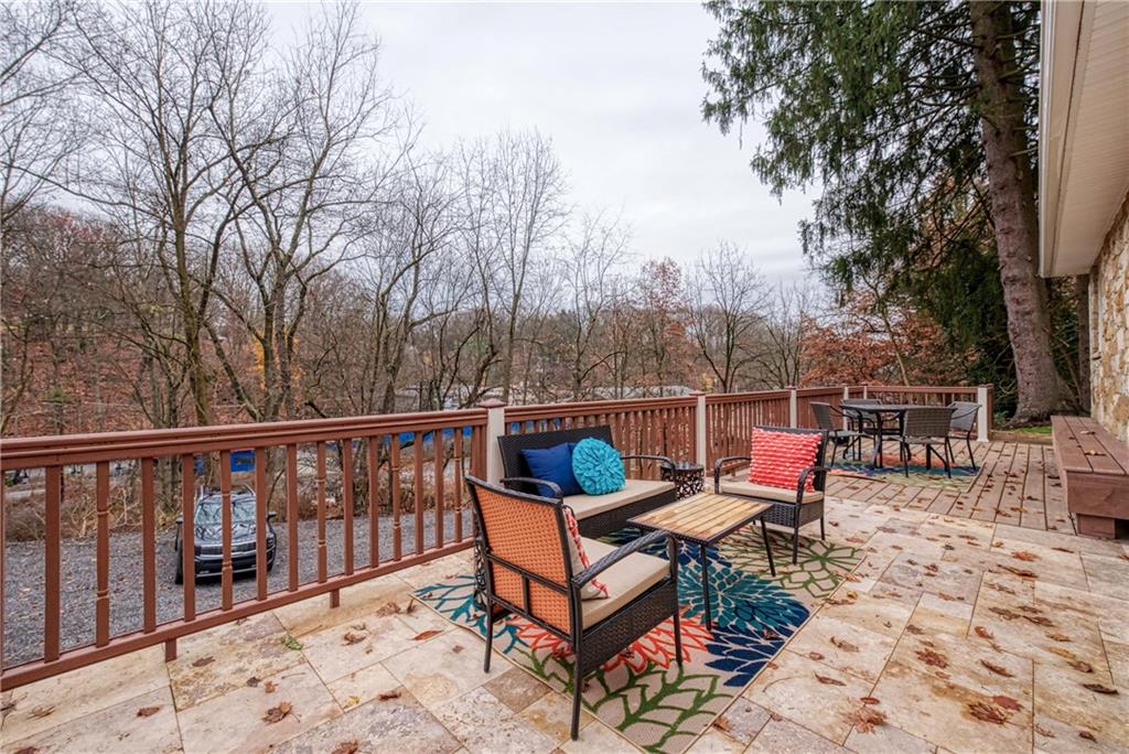 149 Three Degree Road Pittsburgh, PA 15237 - Photo 46 of 50 a view of a terrace with chairs and wooden fence
