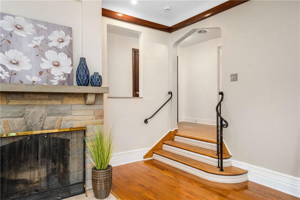 149 Three Degree Road Pittsburgh, PA 15237 - Photo 5 of 50 a living room with wooden floor and a fireplace