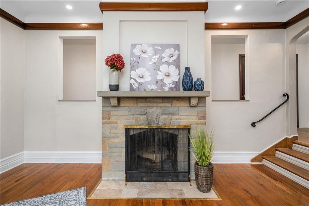 149 Three Degree Road Pittsburgh, PA 15237 - Photo 9 of 50 a living room with a fireplace and a wooden floor