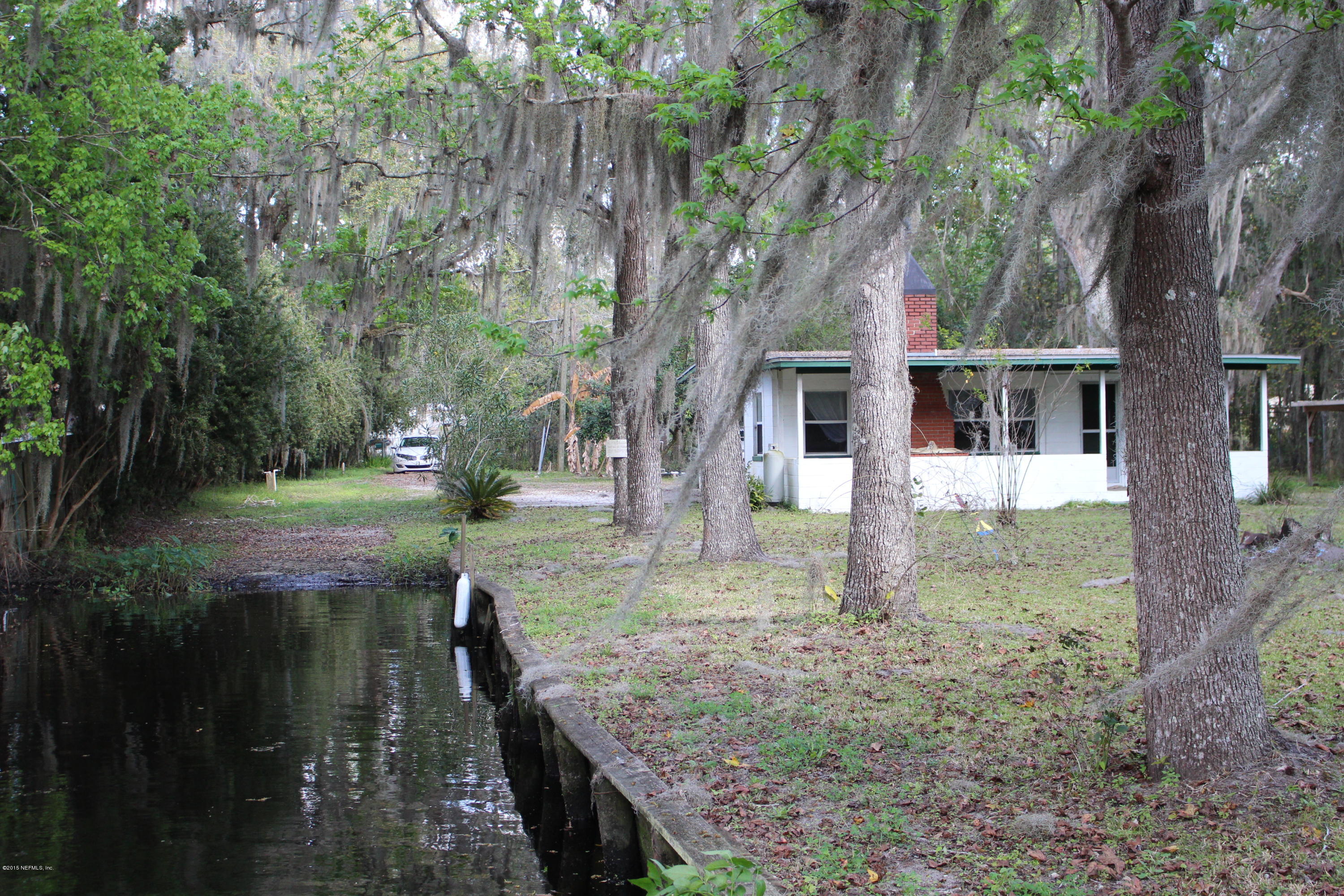 7891 Rusty Anchor Road St. Augustine, FL 32092 - Photo 4 of 21 front view of a house with a yard
