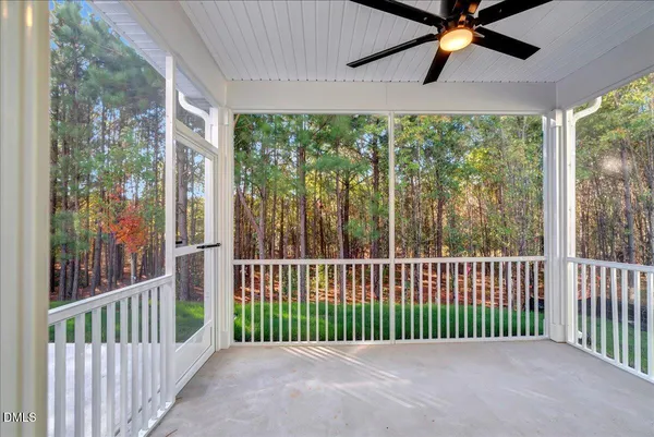 a view of a balcony with wooden floor