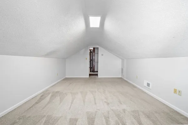 a view of a balcony with wooden floor