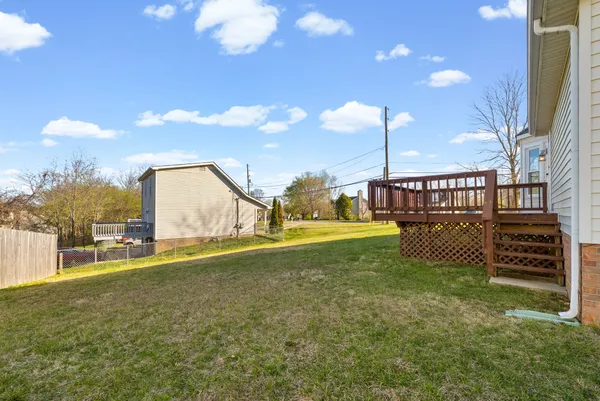 a front view of a house with a yard table and chairs