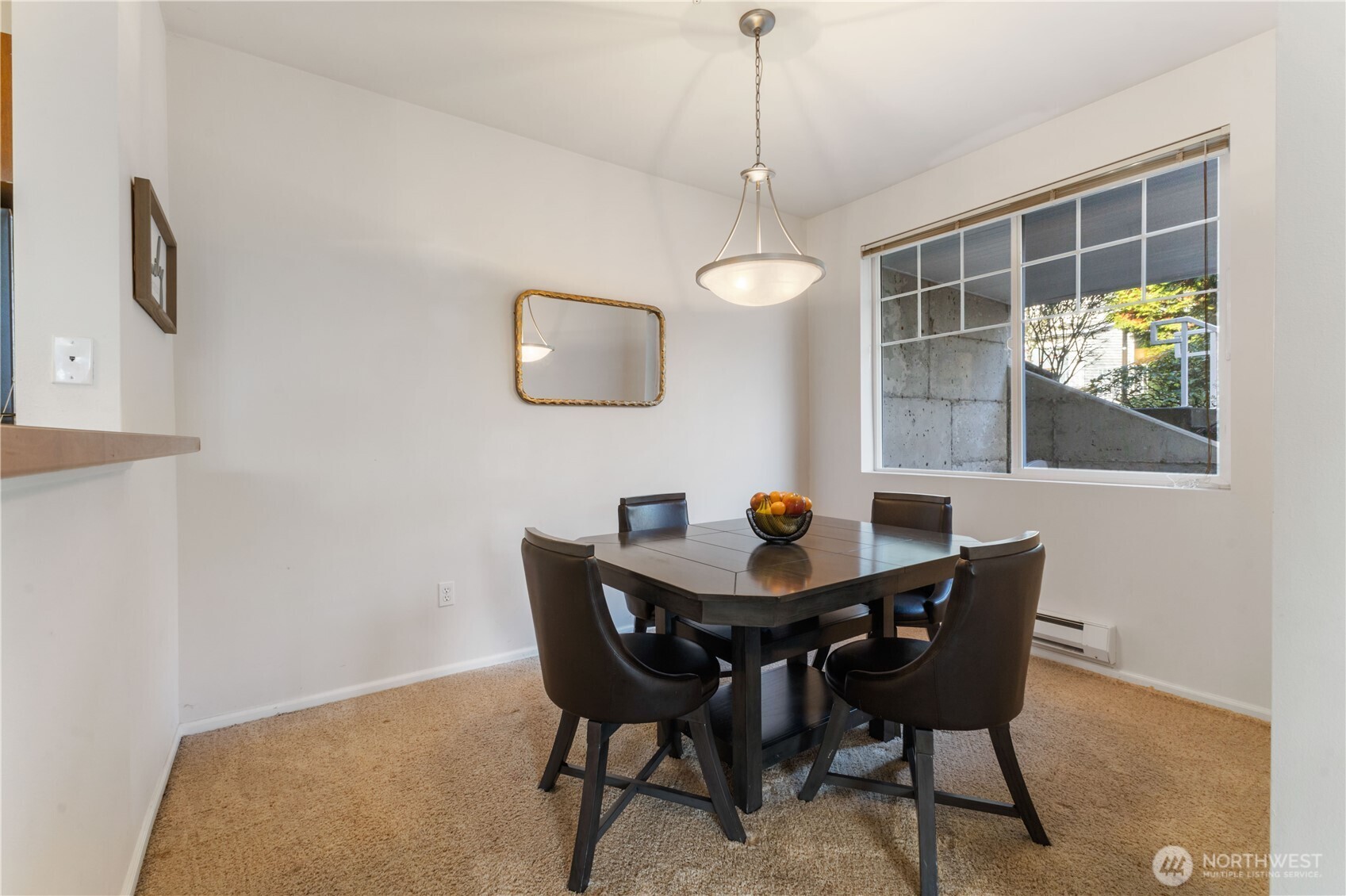 21430 40th Place South, Unit A Seattle, WA 98198 - Photo 12 of 27 a view of a dining room with furniture and chandelier