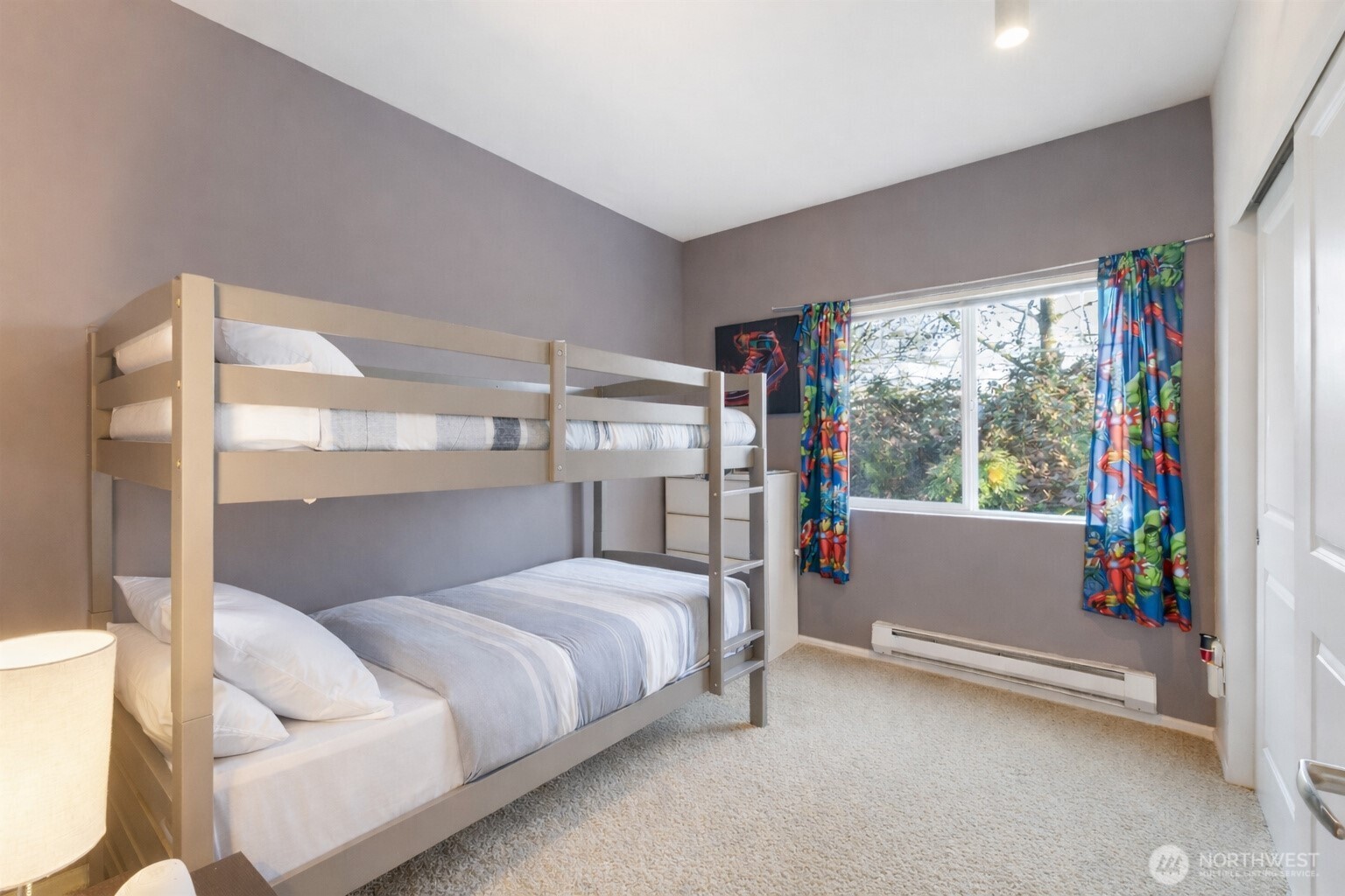 21430 40th Place South, Unit A Seattle, WA 98198 - Photo 15 of 27 a bedroom with a bed and a large window