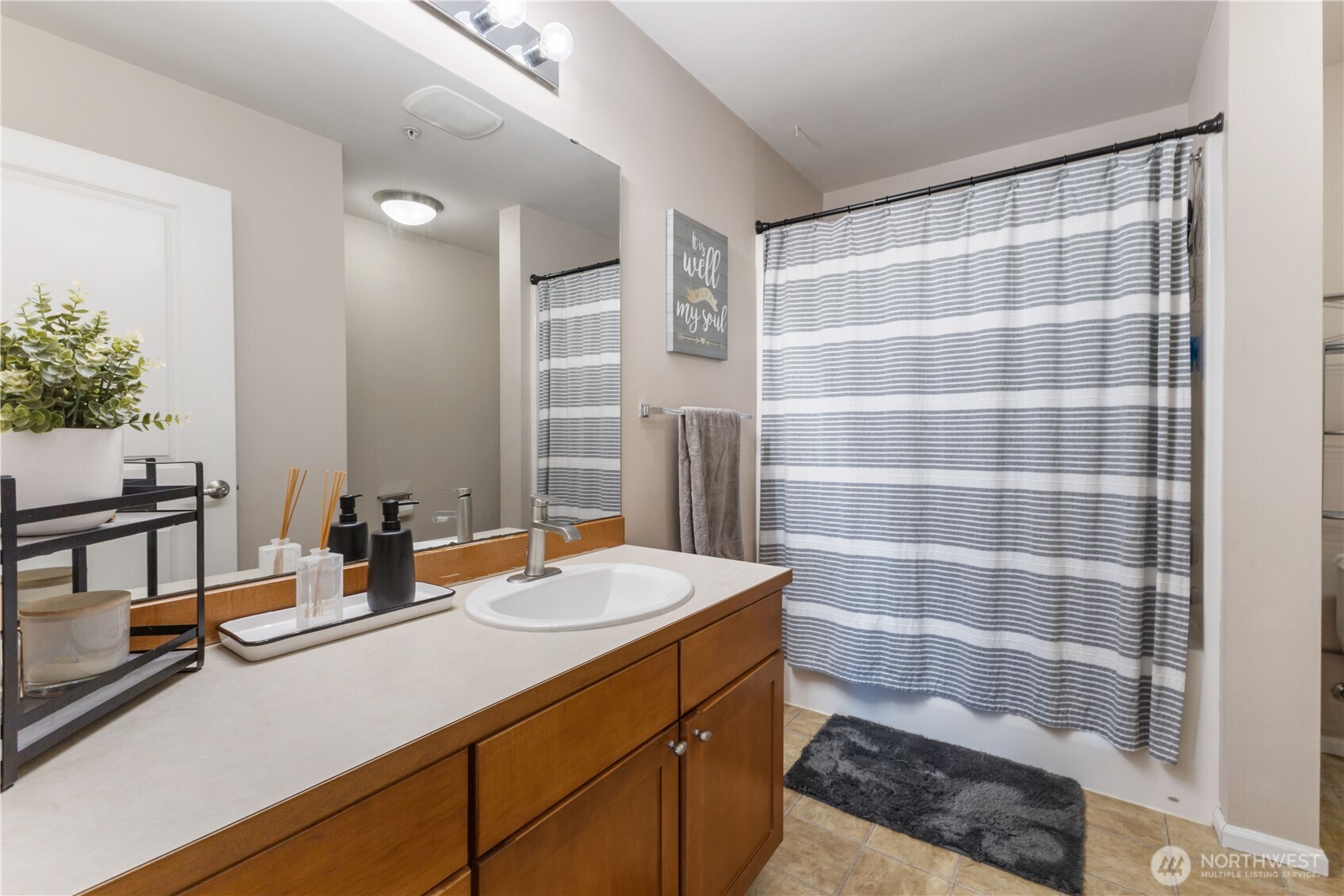 21430 40th Place South, Unit A Seattle, WA 98198 - Photo 16 of 27 a bathroom with a sink double vanity and a mirror