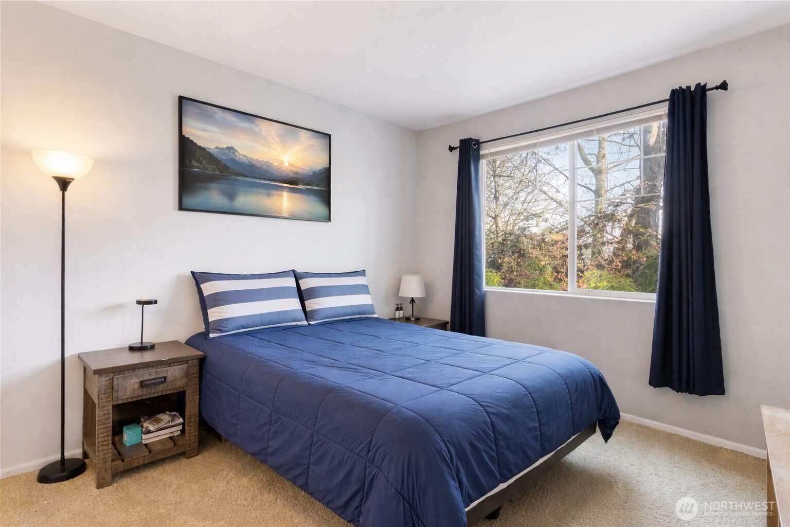 21430 40th Place South, Unit A Seattle, WA 98198 - Photo 18 of 27 a bedroom with a bed and a window