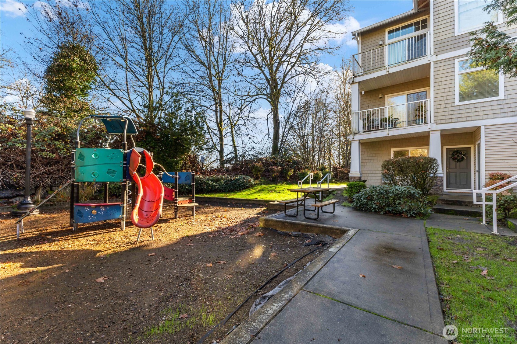21430 40th Place South, Unit A Seattle, WA 98198 - Photo 26 of 27 a view of a backyard with swimming pool