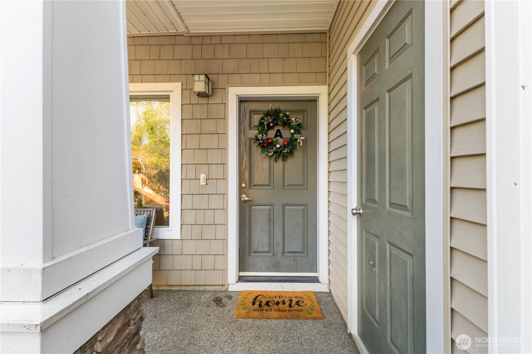 21430 40th Place South, Unit A Seattle, WA 98198 - Photo 3 of 27 a view of front door of house with a potted plant