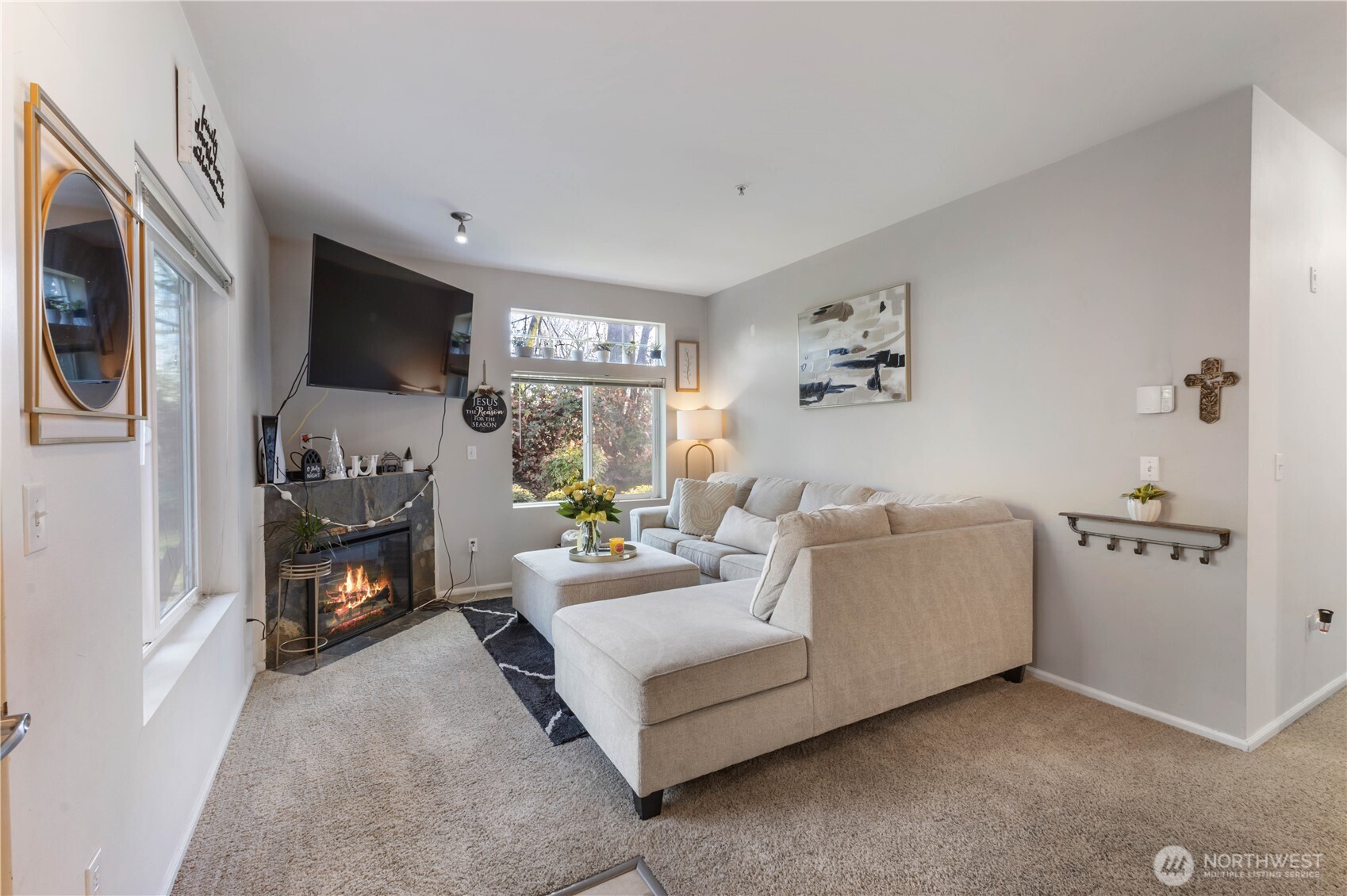 21430 40th Place South, Unit A Seattle, WA 98198 - Photo 6 of 27 a living room with furniture and a fireplace