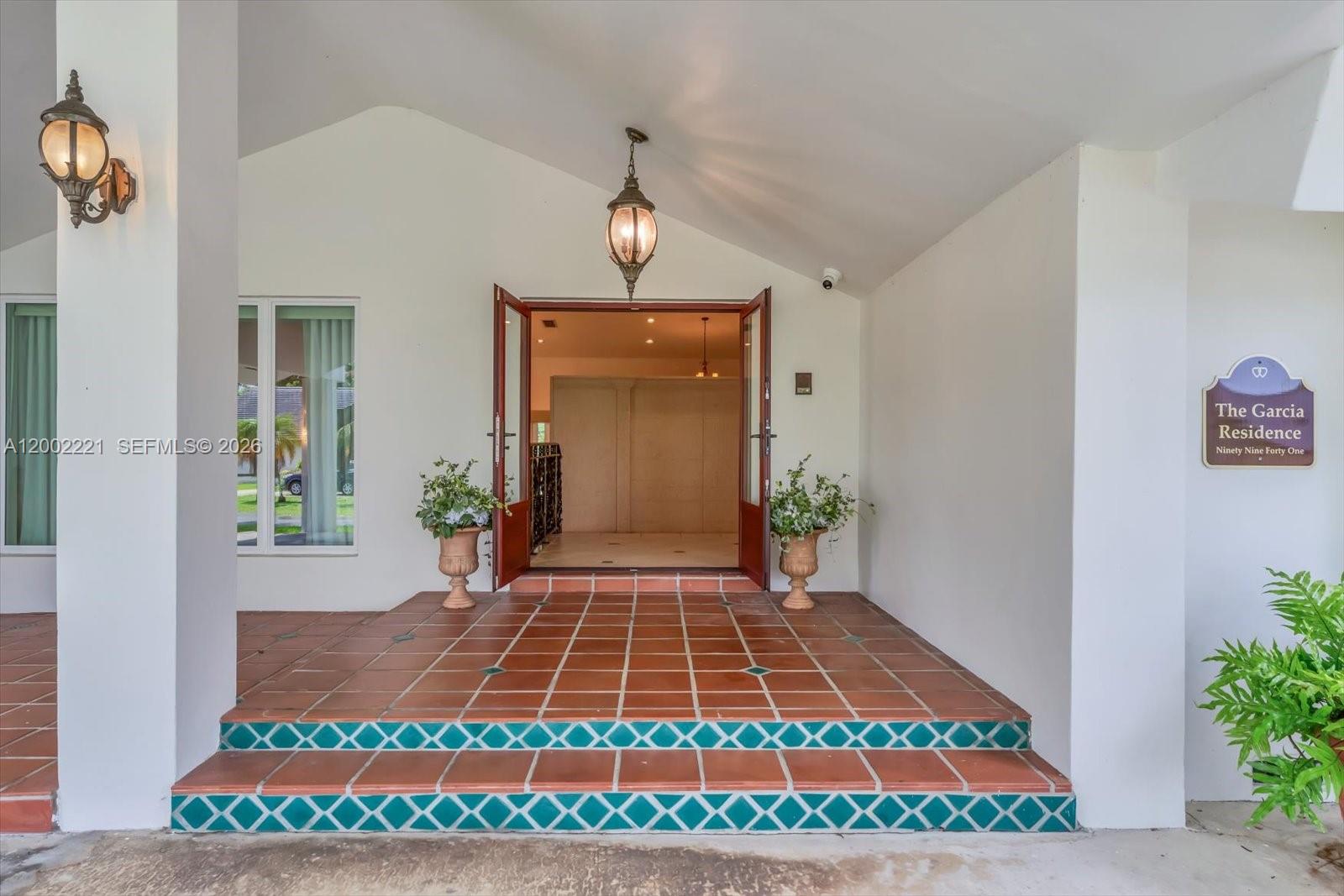 9941 Southwest 143rd Street Miami, FL 33176 - Photo 4 of 48 Additional spacious covered entry way into double impact doors