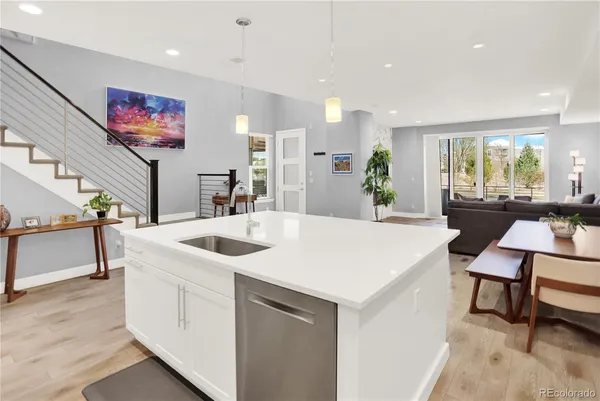 a view of kitchen island a sink and living room