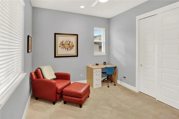 a work room with furniture and a window