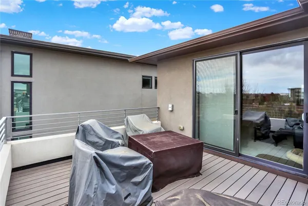 a balcony with furniture and a view of balcony
