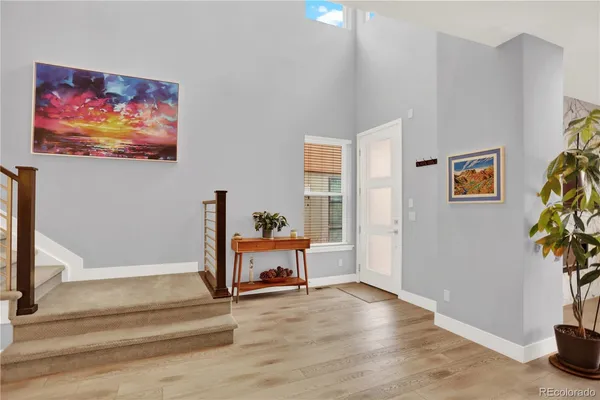 a view of a livingroom with furniture and a potted plant
