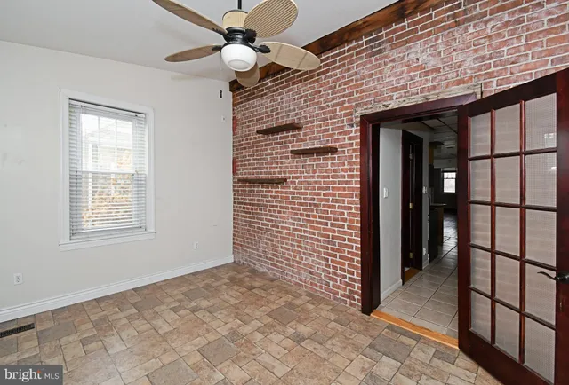 a view of an empty room with a window