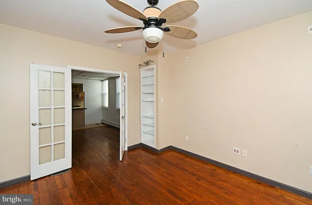a view of a house with wooden fence