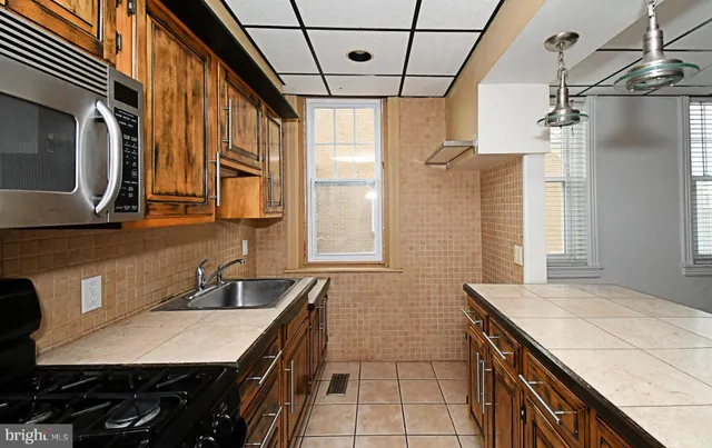 a bathroom with a sink a vanity and a mirror
