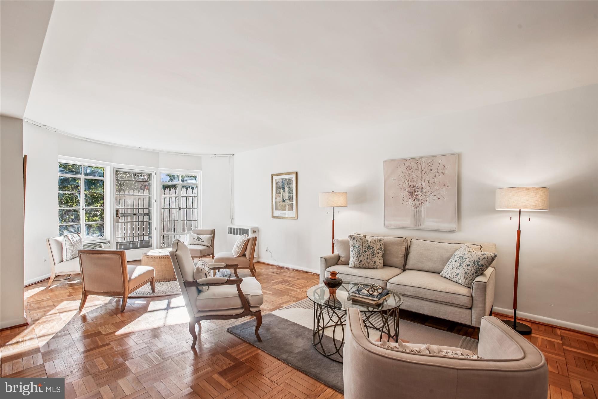 2500 Q Street Northwest, Unit 112 Washington, DC 20007 - Photo 2 of 19 a living room with furniture and a lamp