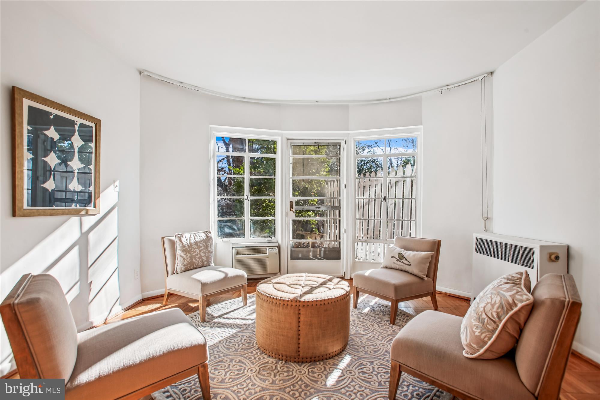2500 Q Street Northwest, Unit 112 Washington, DC 20007 - Photo 3 of 19 a living room with furniture and a large window