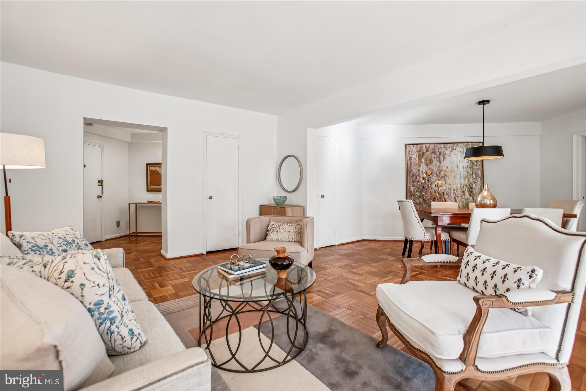 2500 Q Street Northwest, Unit 112 Washington, DC 20007 - Photo 4 of 19 a living room with furniture a rug and white walls