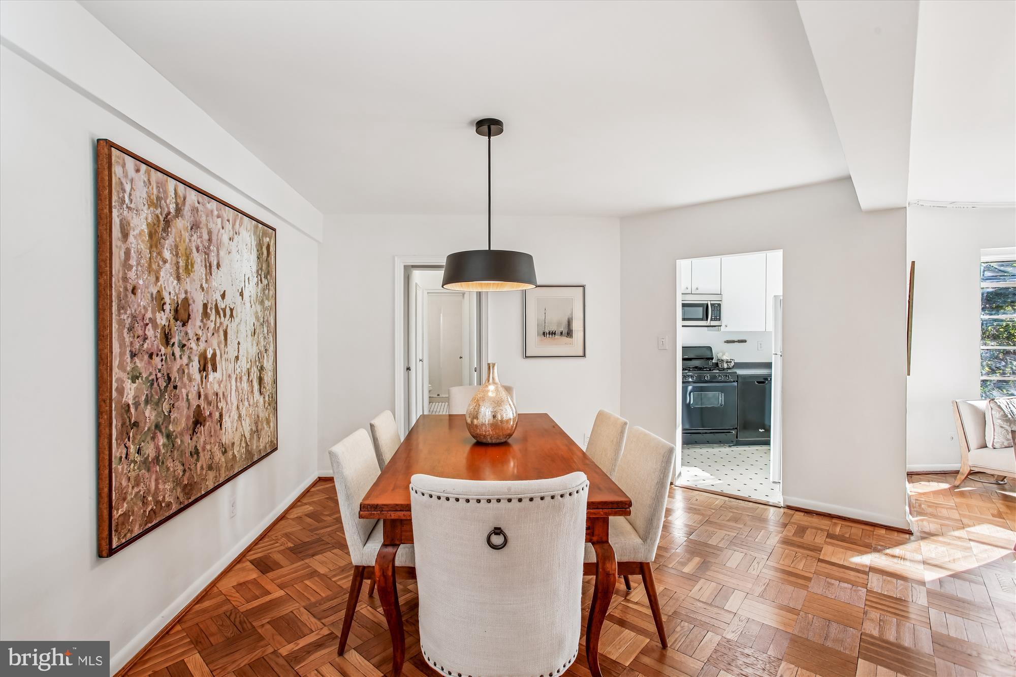 2500 Q Street Northwest, Unit 112 Washington, DC 20007 - Photo 7 of 19 a living room with furniture and a window