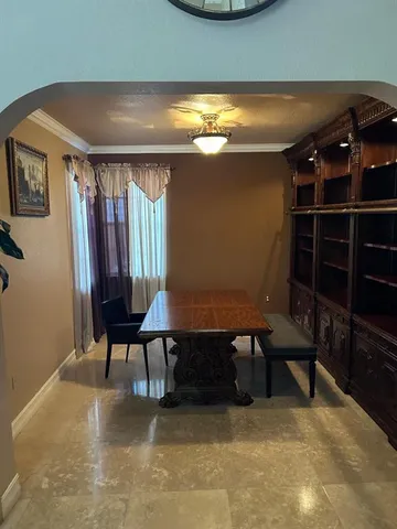 a view of a livingroom with furniture and window