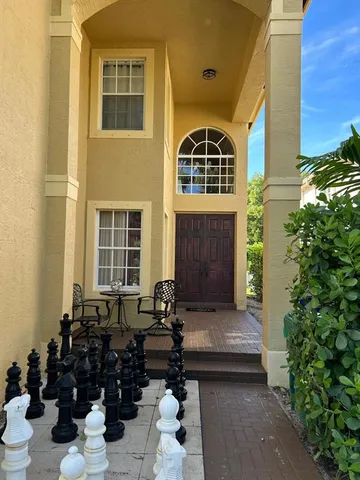 a front view of a house with many windows