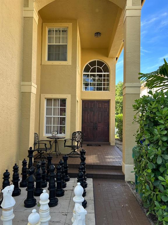 13118 Southwest 45th Drive Miramar, FL 33027 - Photo 2 of 13 a front view of a house with many windows