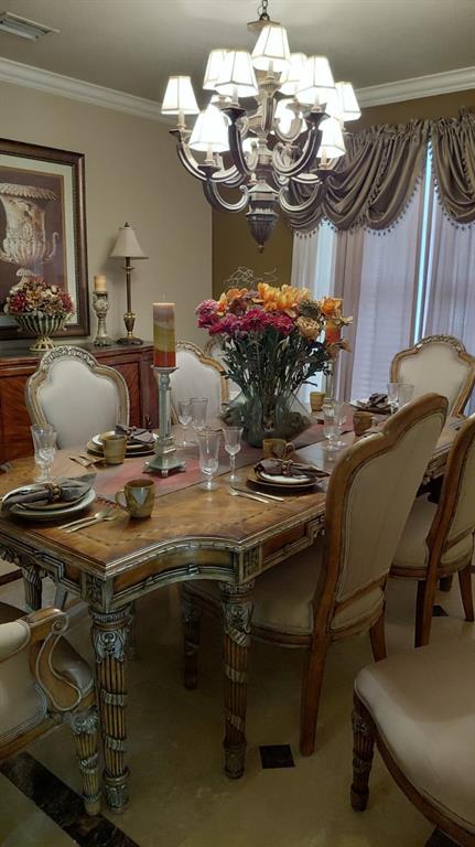 13118 Southwest 45th Drive Miramar, FL 33027 - Photo 6 of 13 a view of a dining room with furniture and chandelier