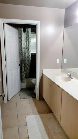 a bathroom with a sink a mirror and a shower