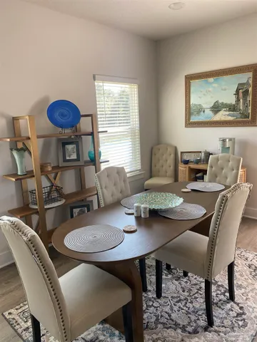 a view of a dining room with furniture