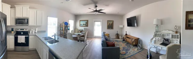 a view of a living room and dining room