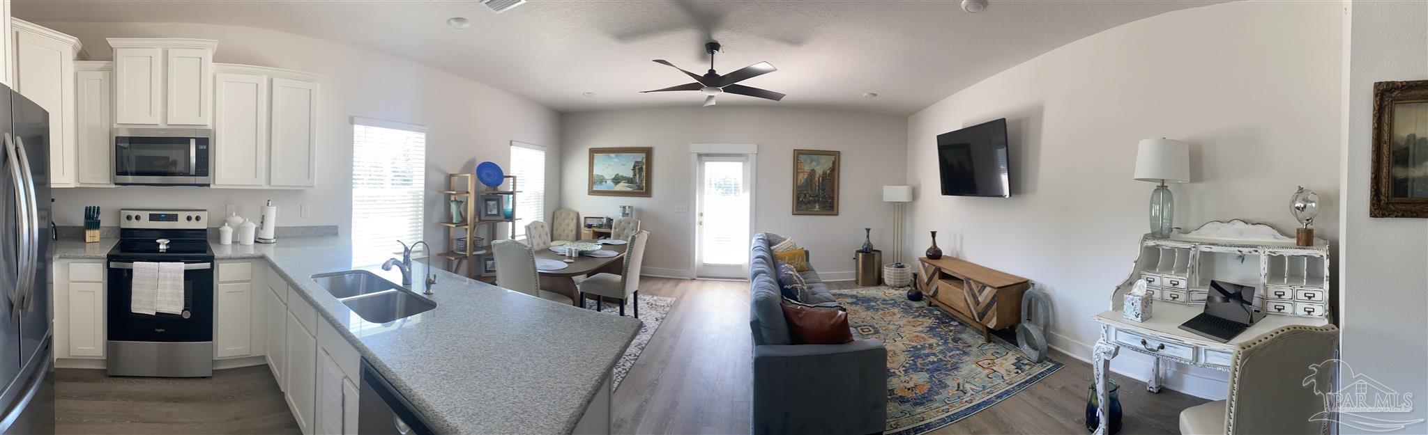 9613 Nature Creek Boulevard Pensacola, FL 32526 - Photo 4 of 10 a view of a living room and dining room