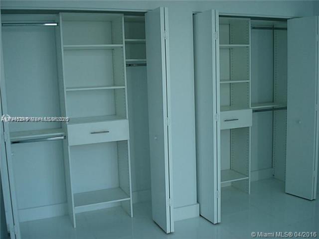 92 Southwest 3rd Street, Unit 2006 Miami, FL 33130 - Photo 5 of 13 a bathroom with a closet