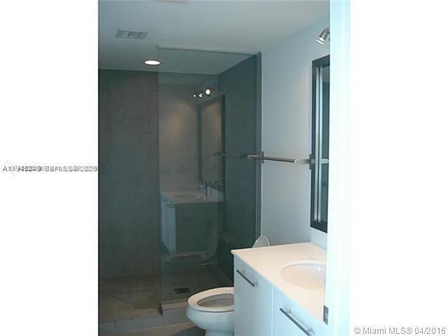 92 Southwest 3rd Street, Unit 2006 Miami, FL 33130 - Photo 7 of 13 a bathroom with a sink a toilet and shower