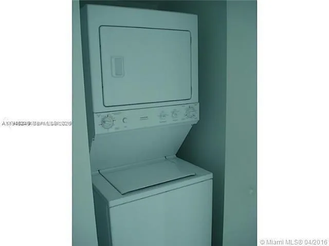 a bathroom with a sink shower and a mirror