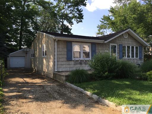 266 Raritan Boulevard Old Bridge, NJ 07735 - Photo 3 of 12 a front view of a house with garden