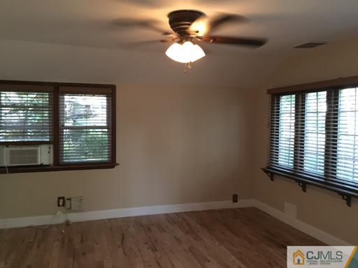 266 Raritan Boulevard Old Bridge, NJ 07735 - Photo 5 of 12 a view of an empty room with a window