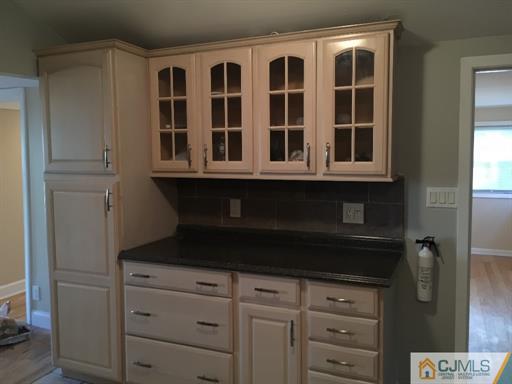 266 Raritan Boulevard Old Bridge, NJ 07735 - Photo 7 of 12 a kitchen with a sink and cabinets