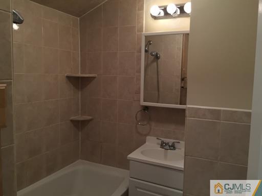 266 Raritan Boulevard Old Bridge, NJ 07735 - Photo 8 of 12 a bathroom with a bathtub